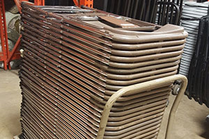 Stack chairs with the top of the chair facing the cart handle.